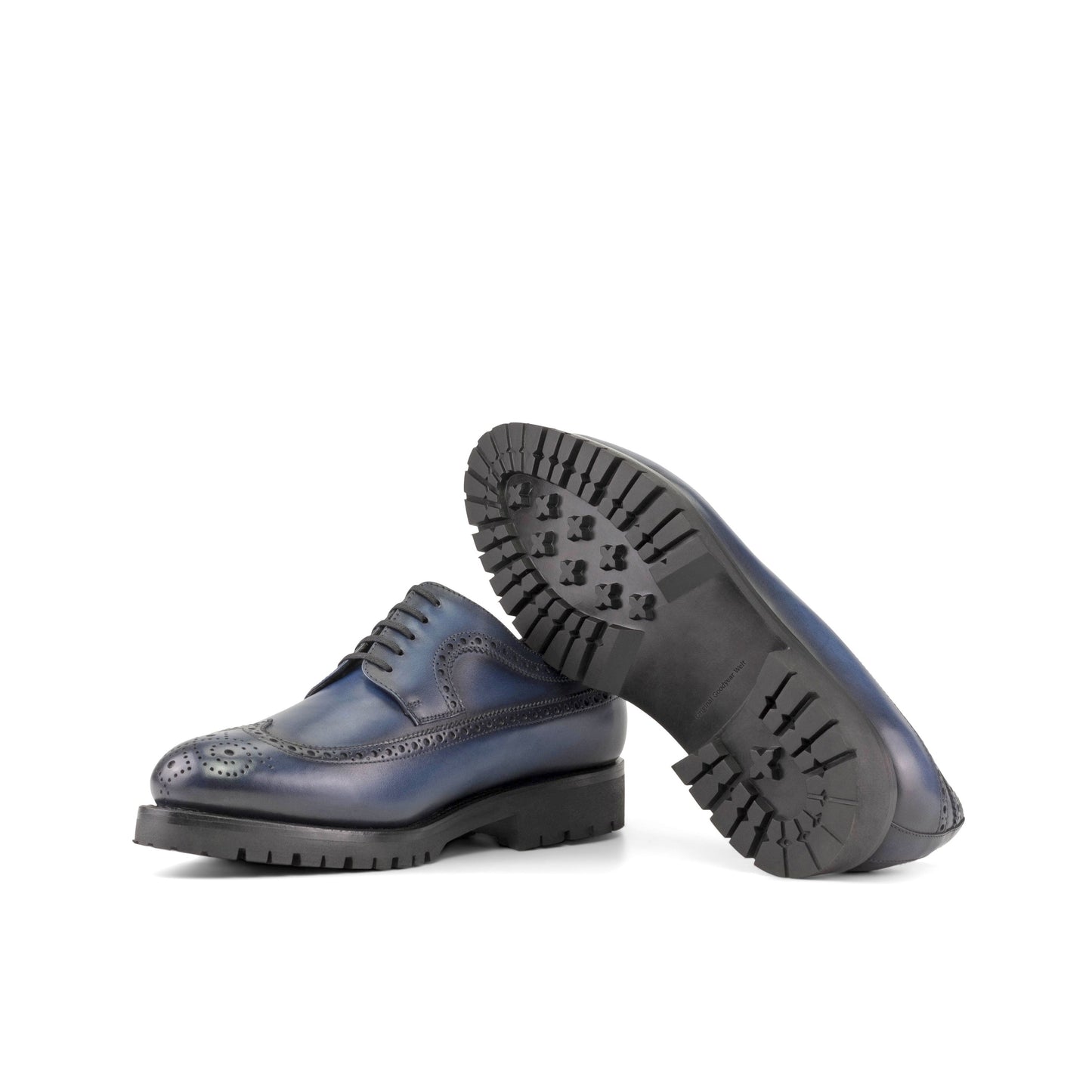 Long Wingtip Derby in Navy Painted Box Calf showing black commando rubber sole
