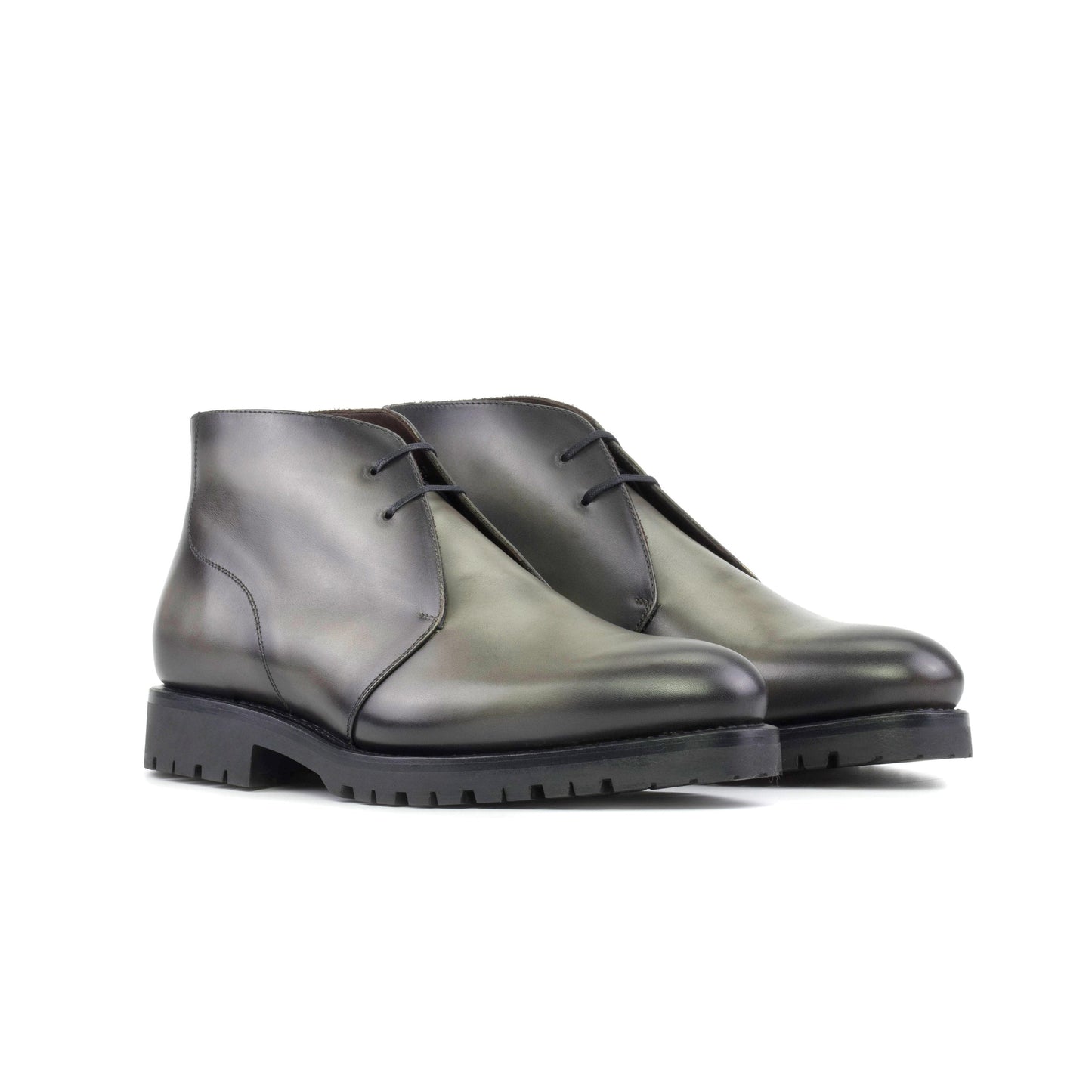 Pair of burnished grey painted box calf Chukka boots, front three-quarter view