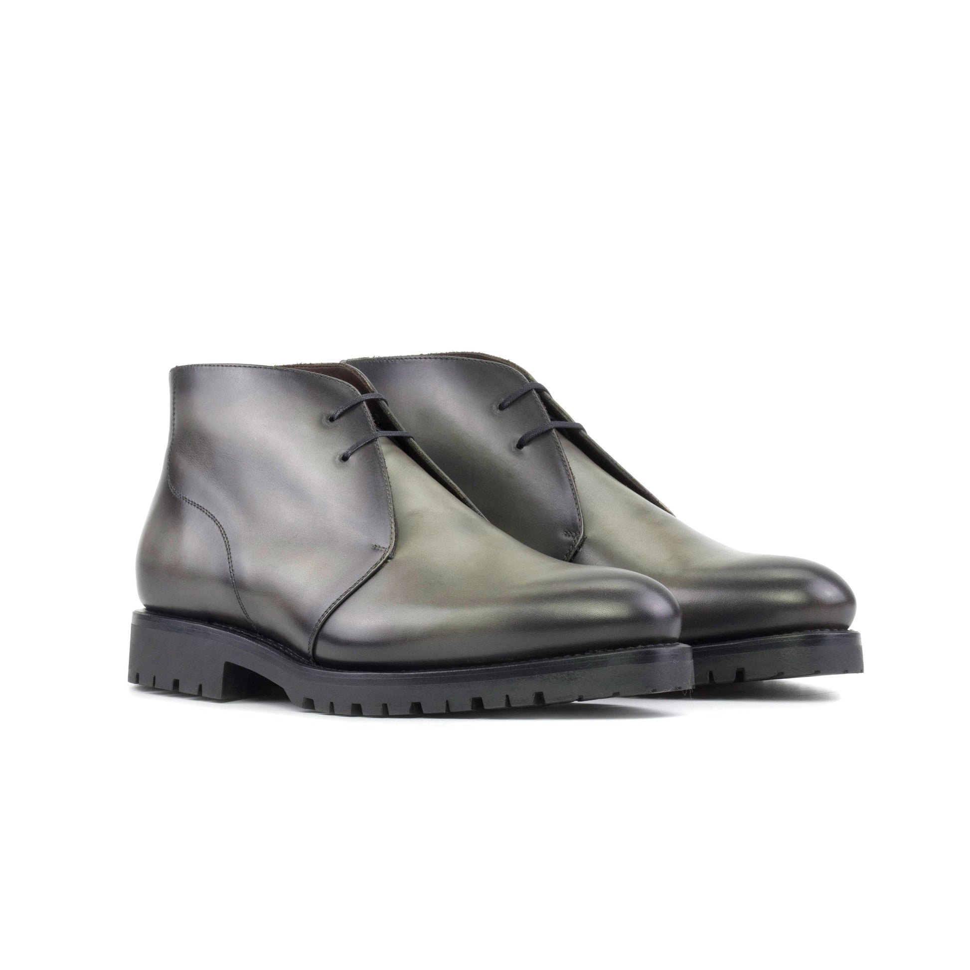 Pair of burnished grey painted box calf Chukka boots, front three-quarter view
