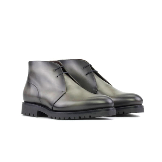 Pair of burnished grey painted box calf Chukka boots, front three-quarter view