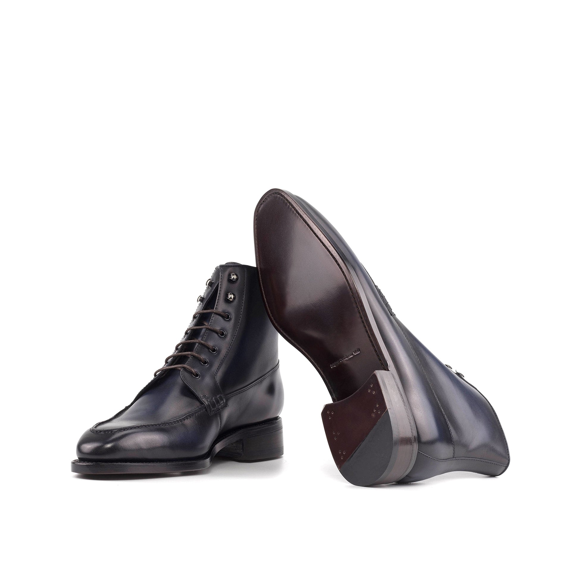 Moc Toe Boot in Burnished Navy Box Calf showing brown leather sole