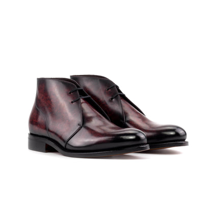Pair of burgundy marble patina box calf Chukka boots, front three-quarter view