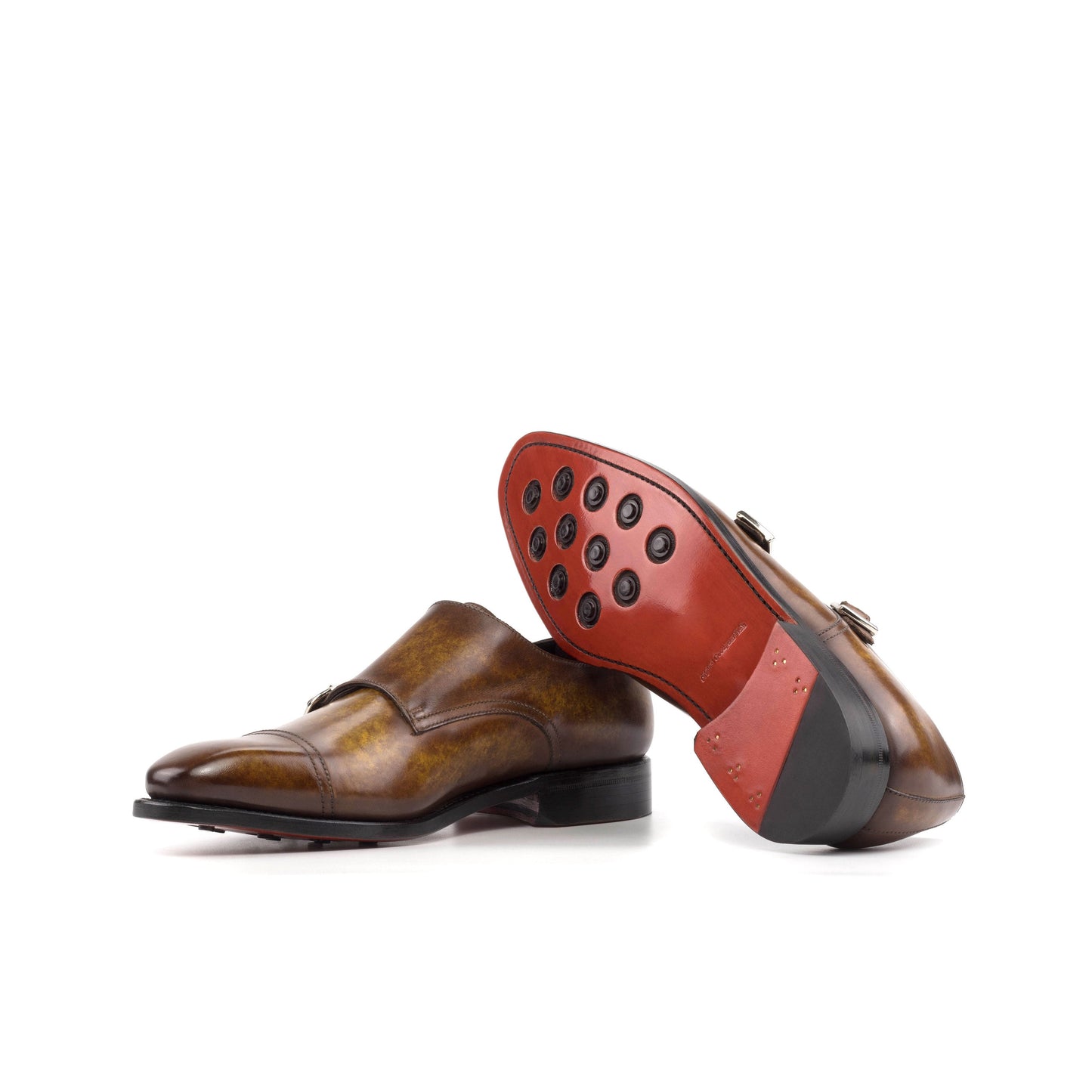 Double Monk Strap in Cognac Marble Patina Box Calf showing red leather sole with rubber button injections