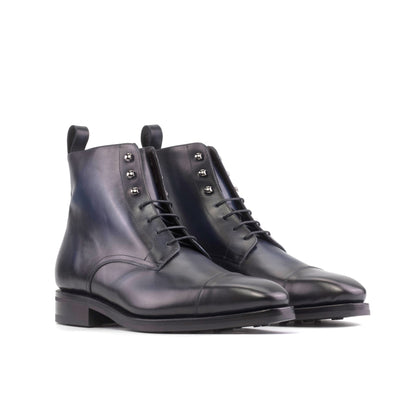 Jumper Boot in Burnished Navy Box Calf, front three-quarter view