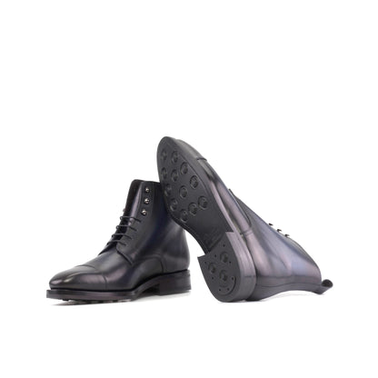 Jumper Boot in Burnished Navy Box Calf showing black dainite rubber sole