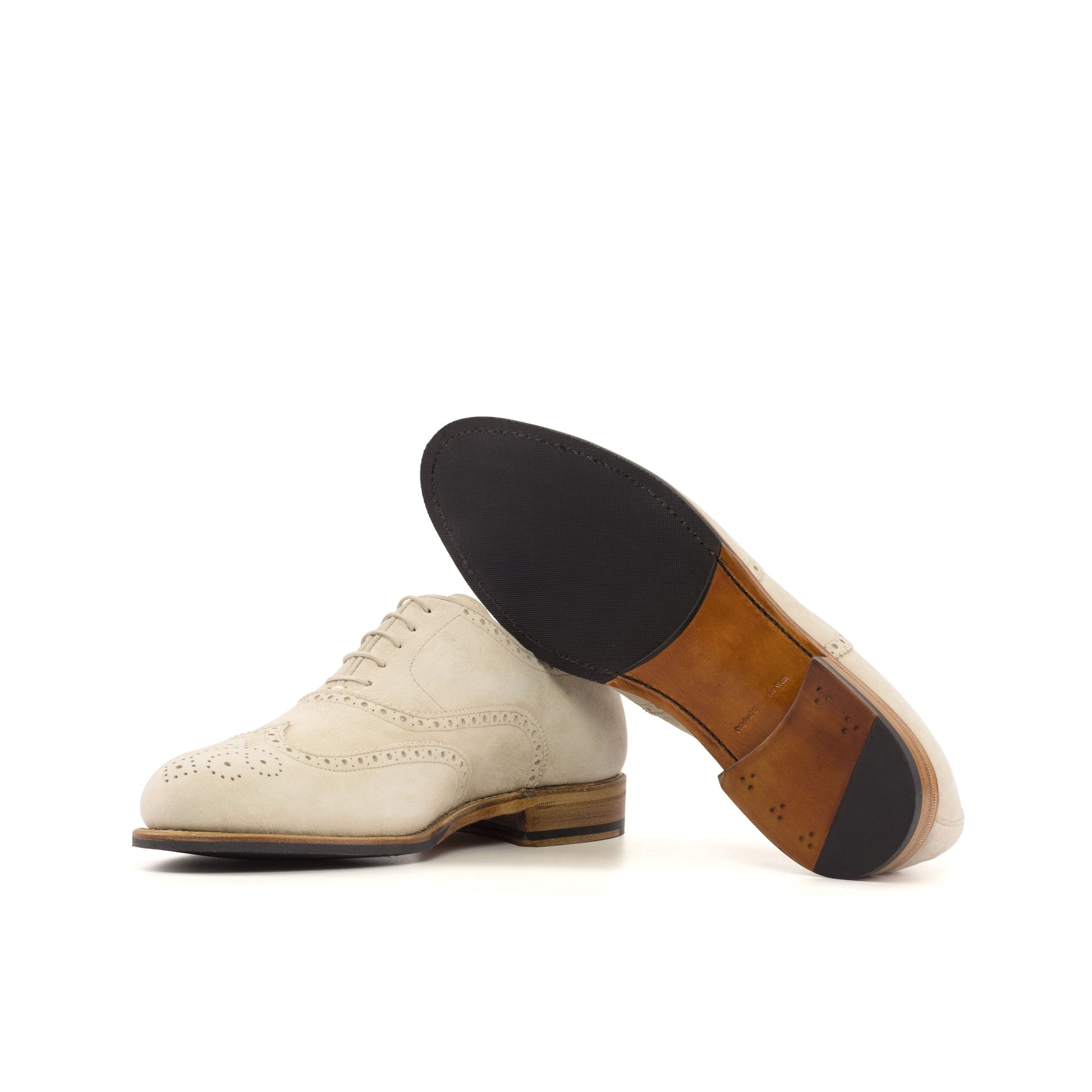 Wingtip Oxford in Ivory Kid Suede showing cognac leather and rubber combination sole