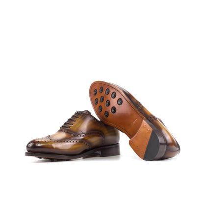 Wingtip Oxford in Cognac Patina Box Calf showing cognac leather sole with rubber button injections