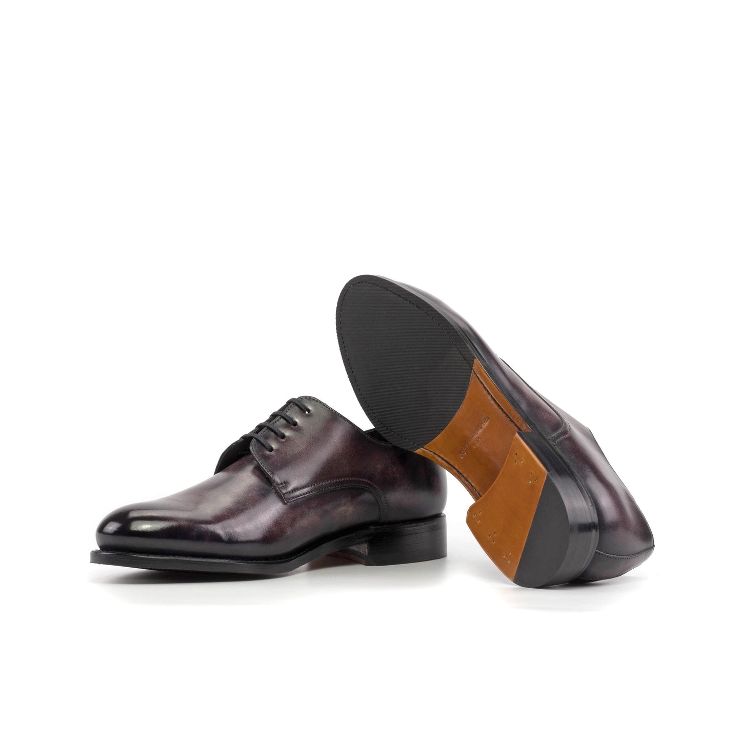 Derby in Aubergine Museum Patina Box Calf showing cognac leather and rubber combination sole