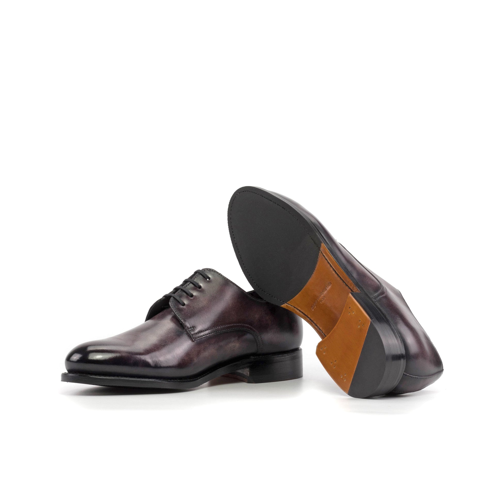 Derby in Aubergine Museum Patina Box Calf showing cognac leather and rubber combination sole