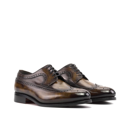 Long Wingtip Derby in Tobacco Museum Patina Box Calf, front three-quarter view