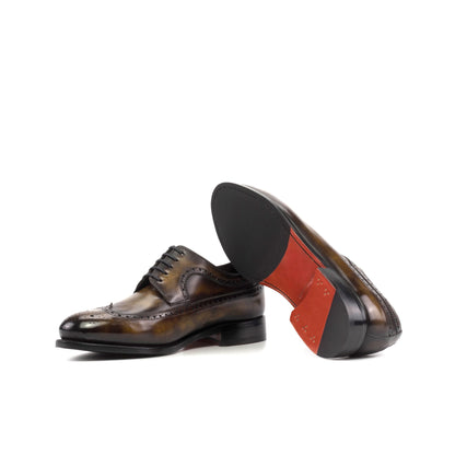 Long Wingtip Derby in Tobacco Museum Patina Box Calf showing red leather and rubber combination sole