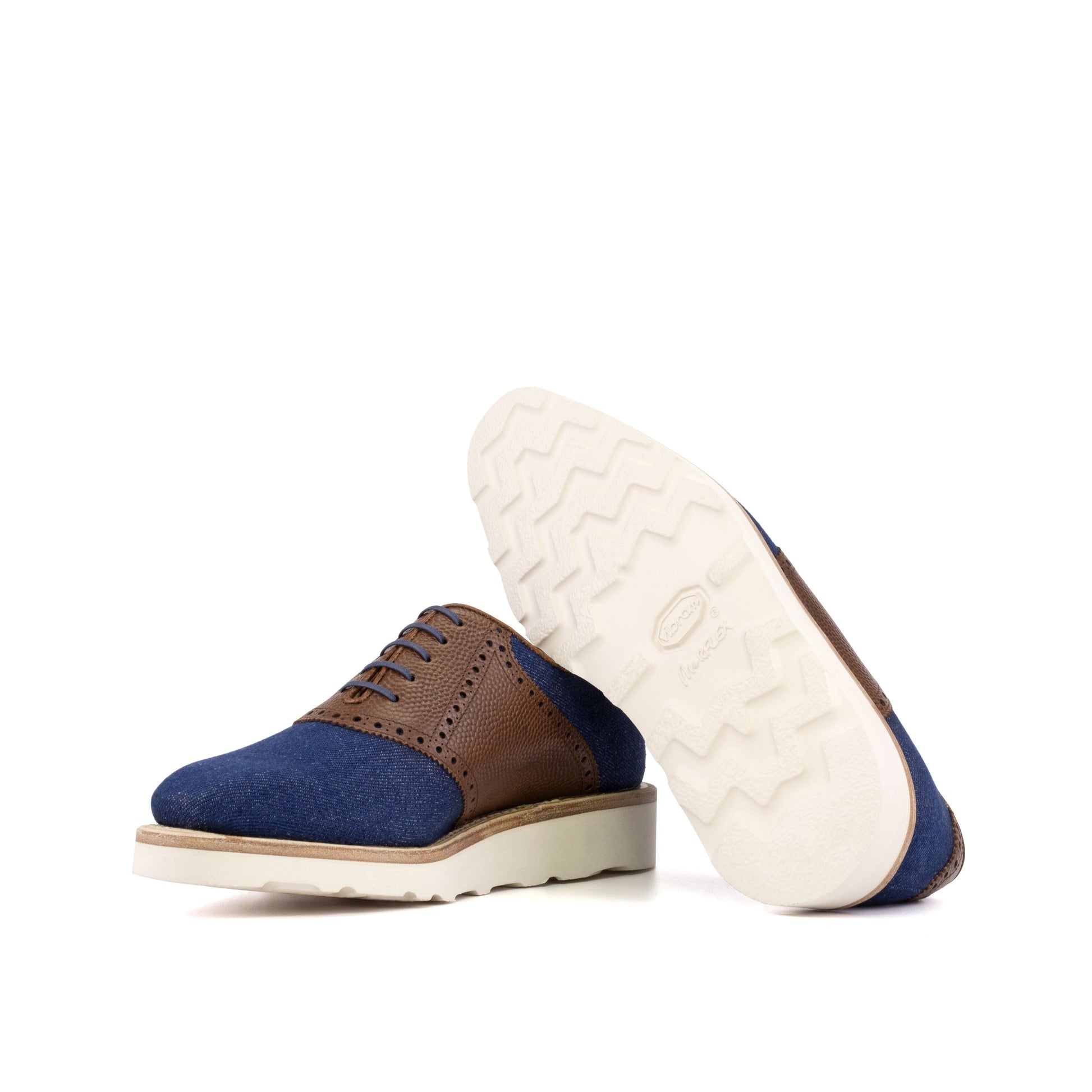 Saddle Shoe in Navy Denim and Medium Brown Painted Pebble-Grain Box Calf showing off-white vibram rubber sole