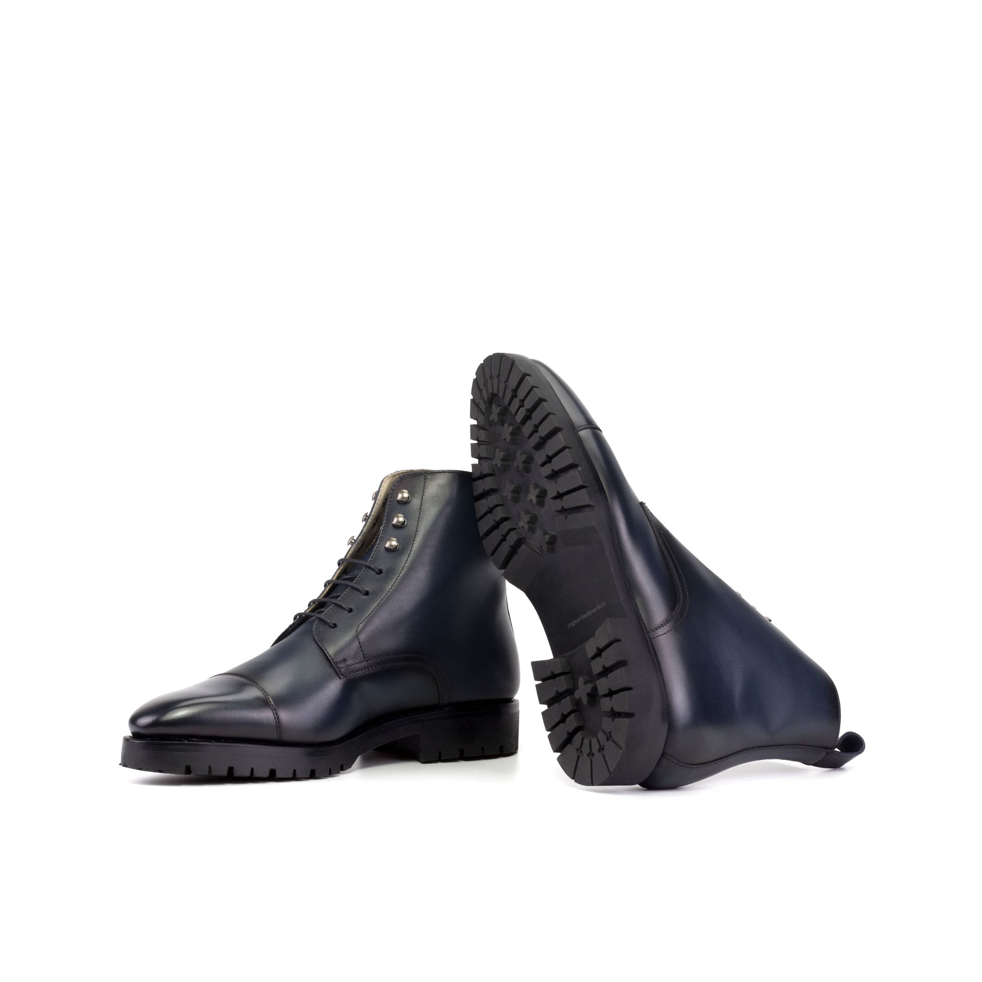 Jumper Boot in Burnished Navy Box Calf showing black commando rubber sole