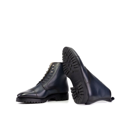 Jumper Boot in Burnished Navy Box Calf showing black commando rubber sole