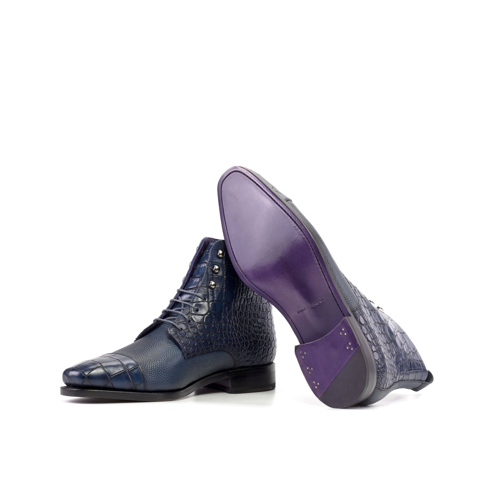 Jumper Boot in Navy Painted Croco-Embossed Box Calf and Navy Painted Pebble-Grain Box Calf showing lilac leather sole