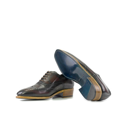 Wingtip Oxford in Burnished Dark Brown Box Calf showing turquoise leather sole