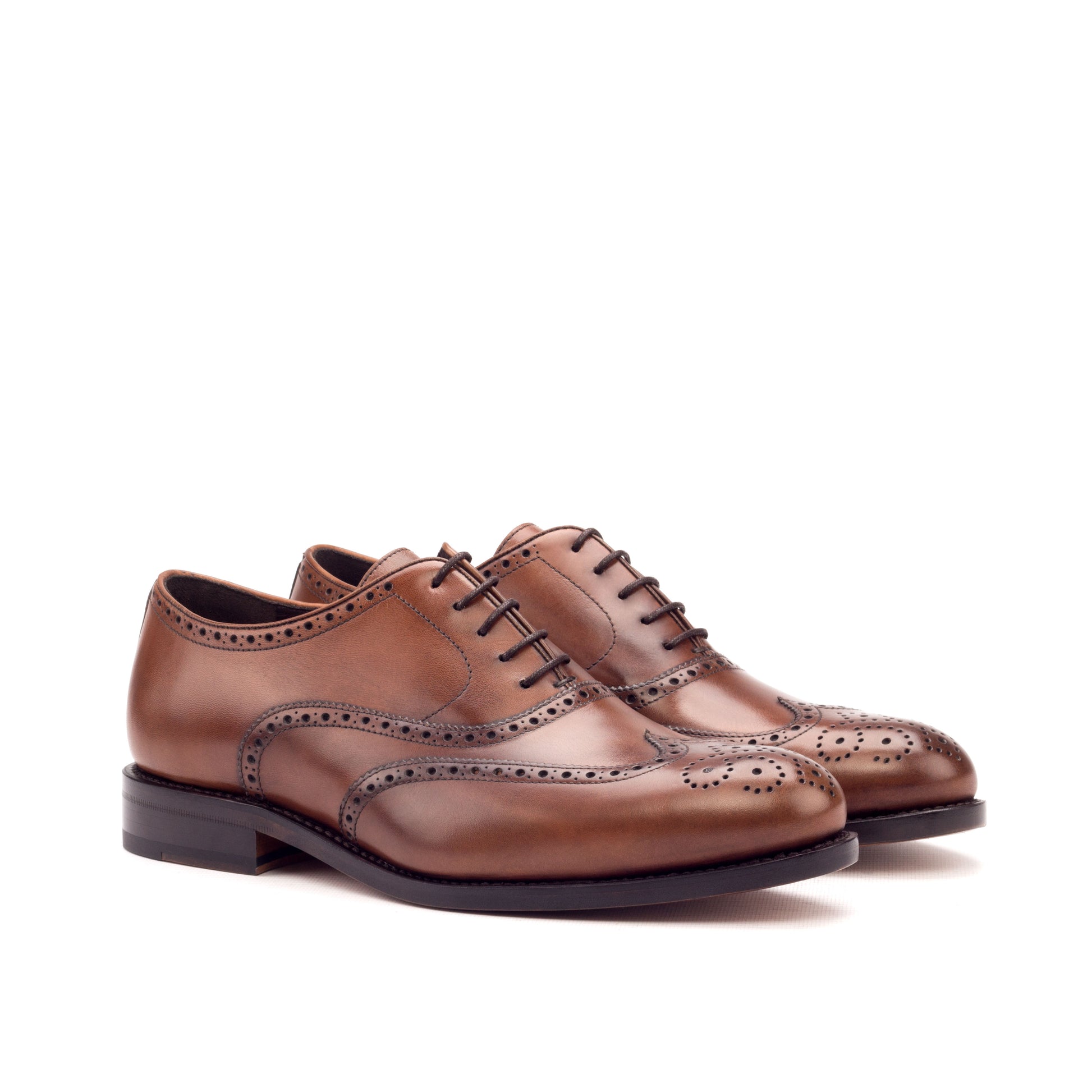 Medium brown painted calf wingtip Oxfords, front three-quarter view
