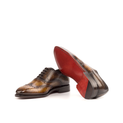 Wingtip Oxford in Cognac Marble Patina Box Calf and Brown Marble Patina Box Calf showing red leather sole