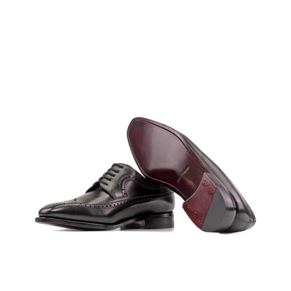 Long Wingtip Derby in Black Box Calf showing dark red leather sole