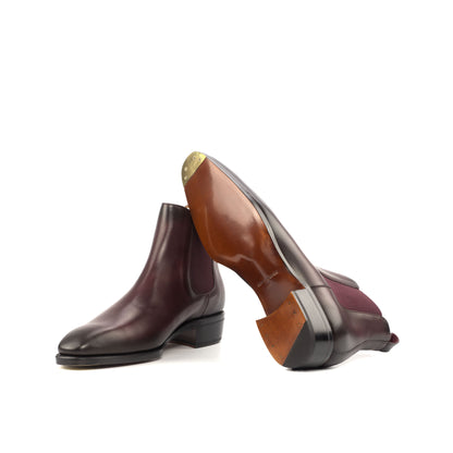 Cognac leather sole and toe plates on burgundy Chelsea boots